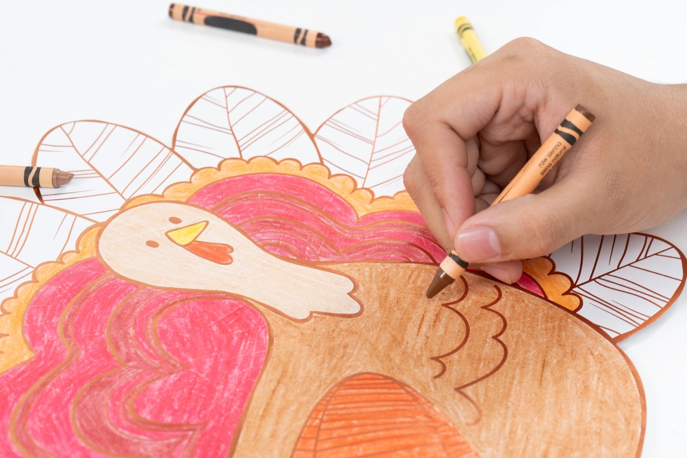Thanksgiving kids activity placemat featuring a large turkey to color