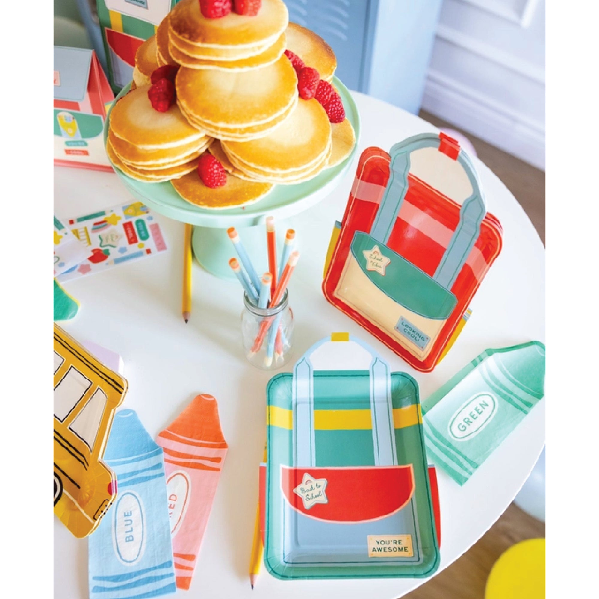 Paper plates shaped like backpacks for school party