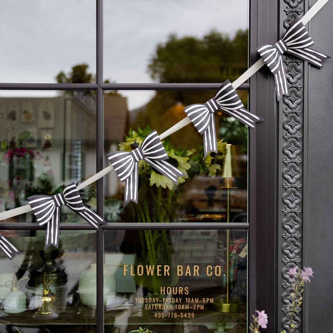 Layered bow garland on cream ribbon