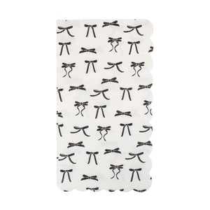 White guest towel with black bow pattern