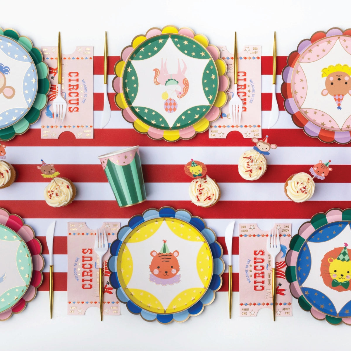 Assorted scalloped paper lunch plates in pink, blue, orange, green, yellow, and teal color combinations.
