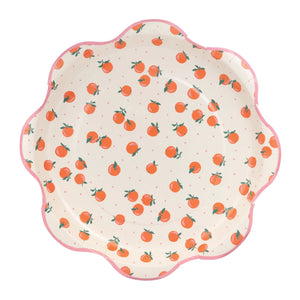 Scalloped lunch plates with orange fruit pattern