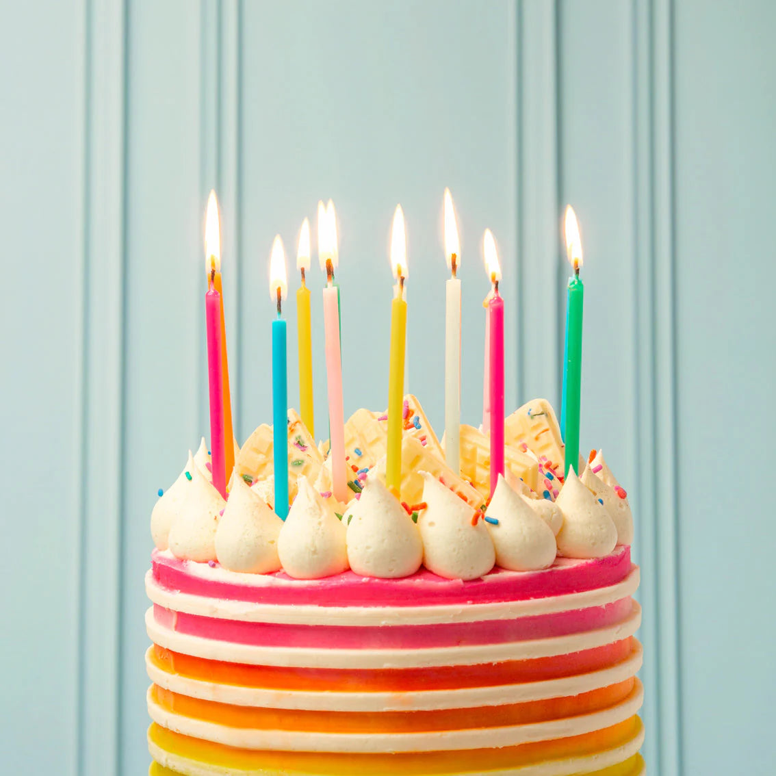 Tall Rainbow Birthday Candles on cake