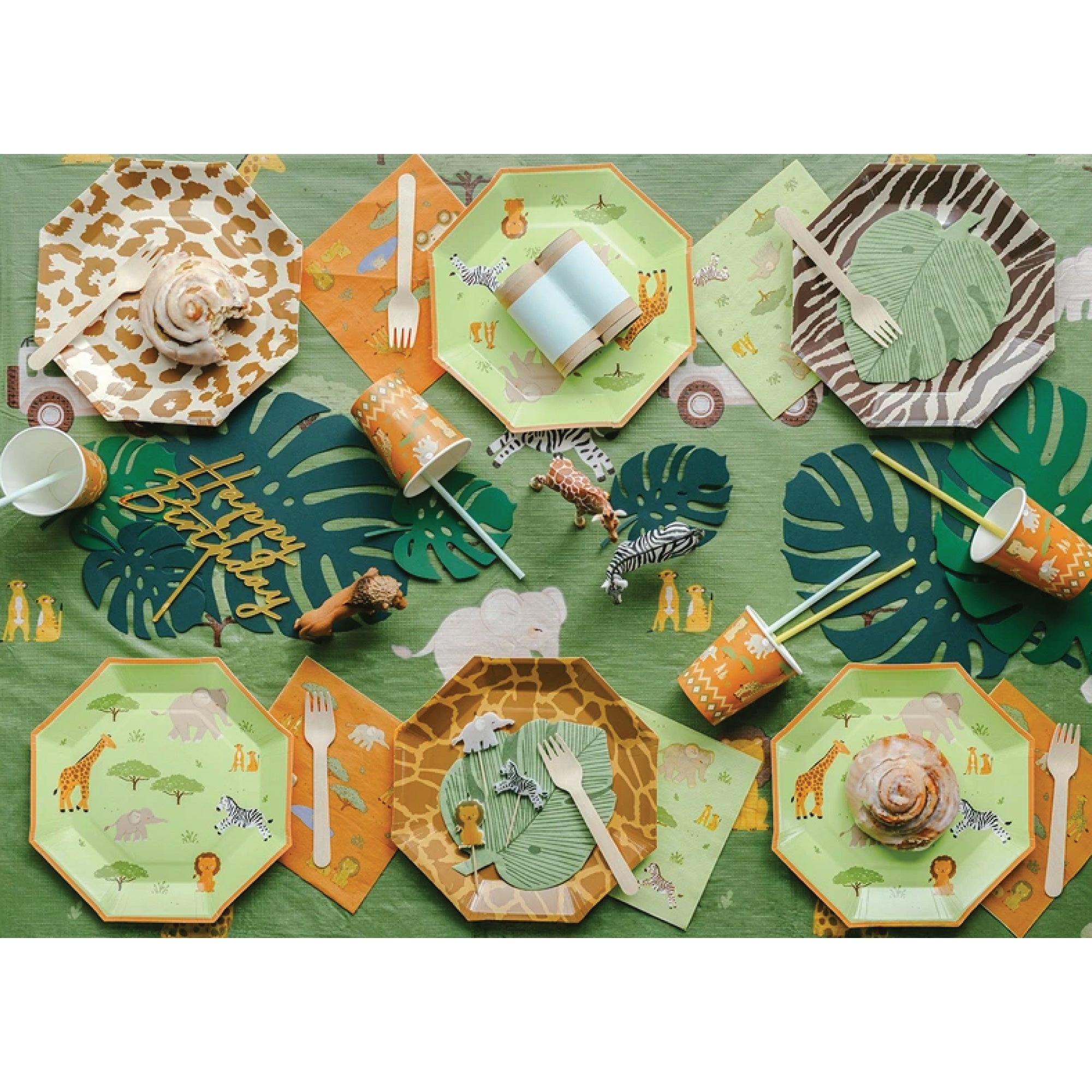 Light green paper plate with elephant, giraffe, zebra, and lion