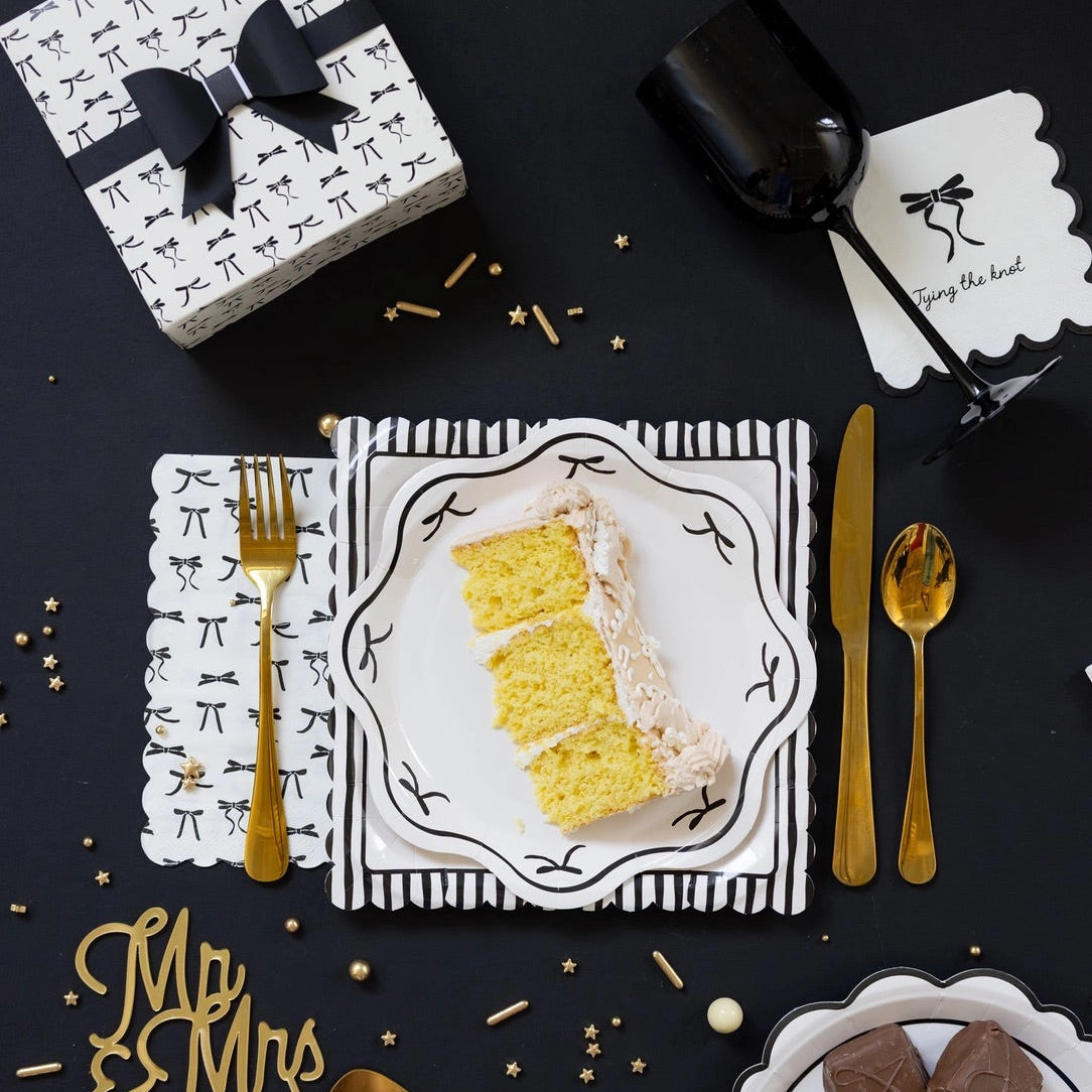 Cream dessert napkin with black bow illustration