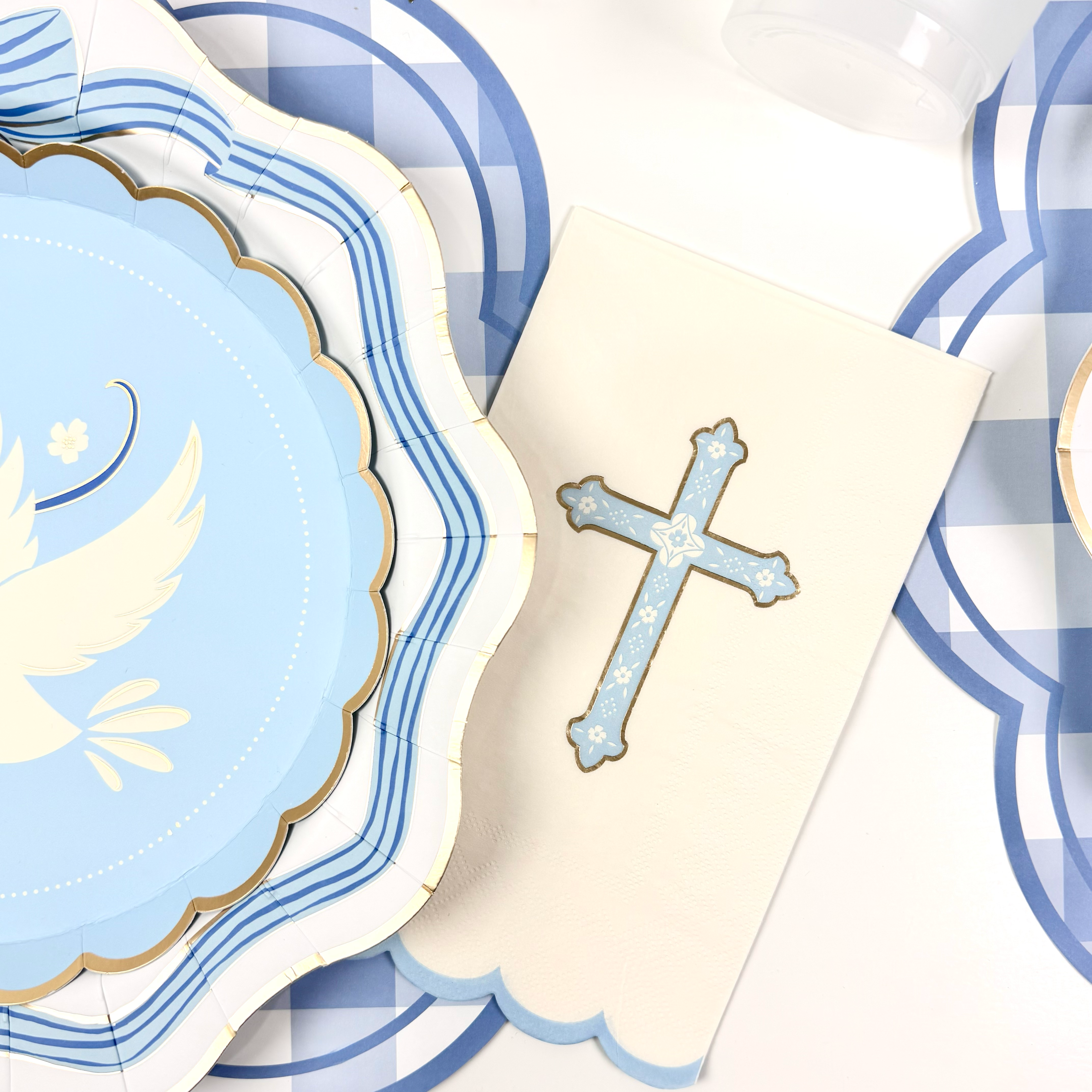 Blue cross guest towel with gold foil details.