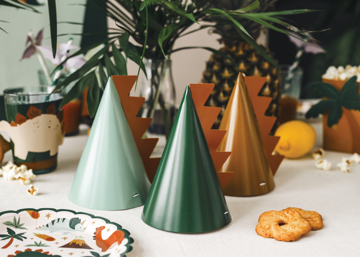 Spiked Dinosaur Party Hats Sitting on Party Table | The Party Darling