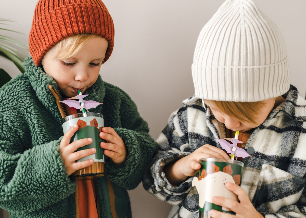 Two Kids using Green & White Striped Pterodactyl Paper Straws | The Party Darling