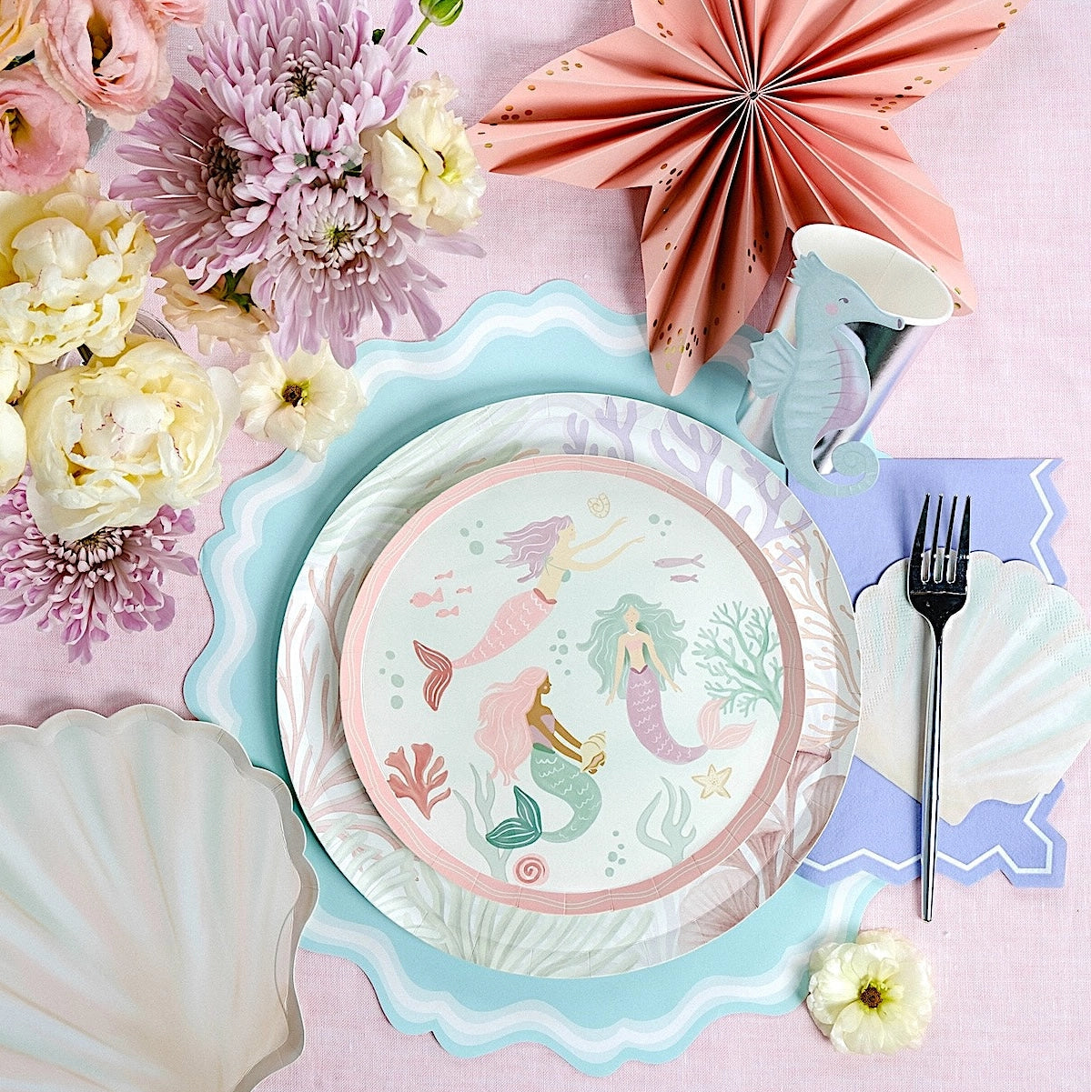 Mermaid-themed dessert plate with pastel ocean details