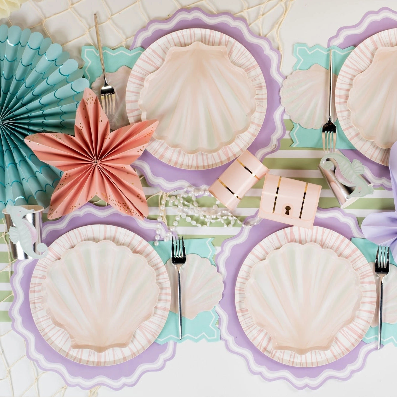 Pastel shell dessert plate with soft blush tones