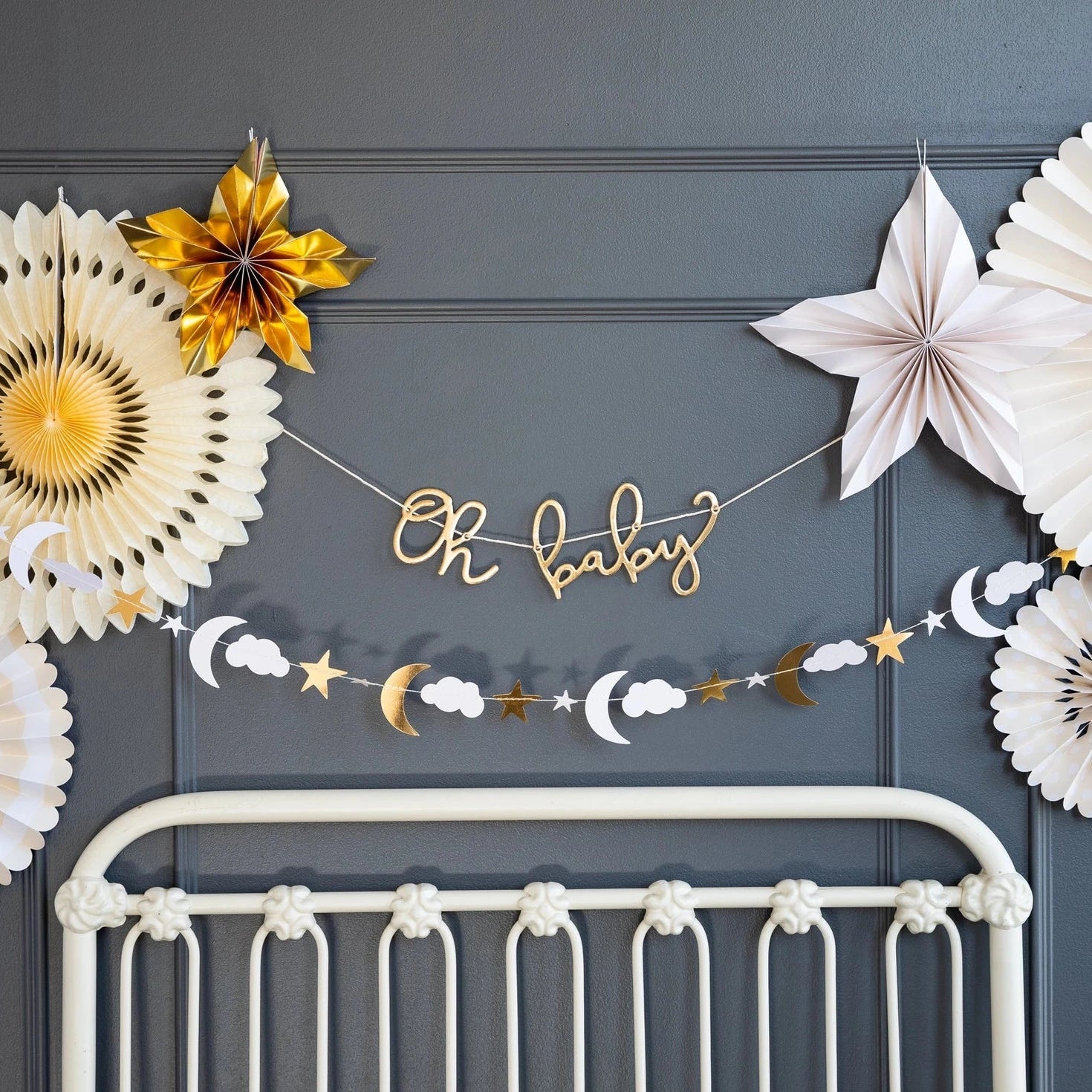 Gold accented baby shower banner displayed on wall
