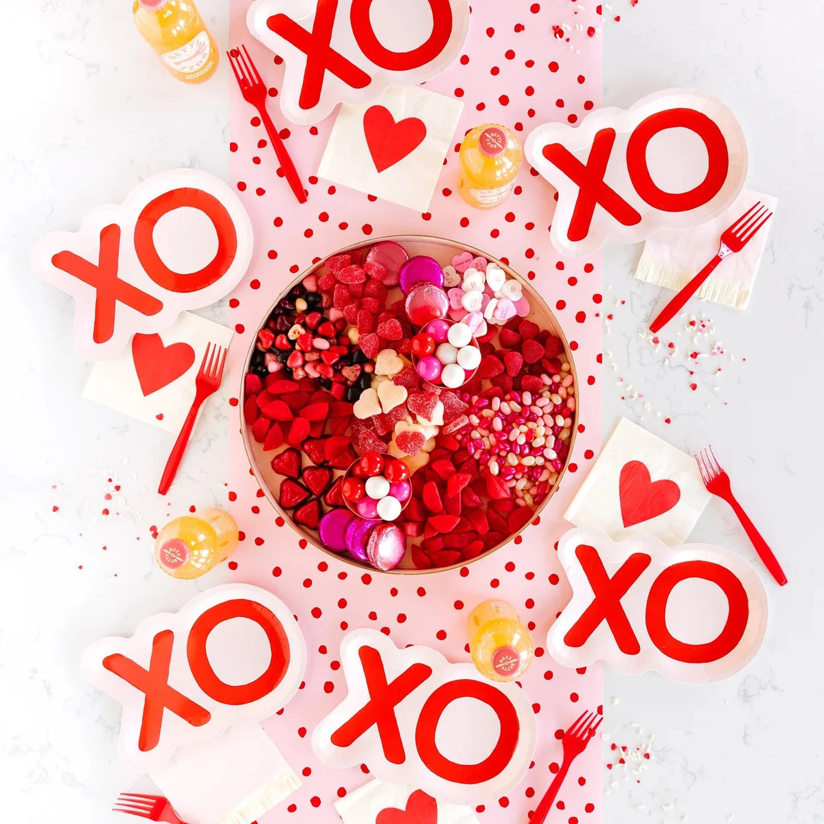 red and pink polka dot table runner with XO plates