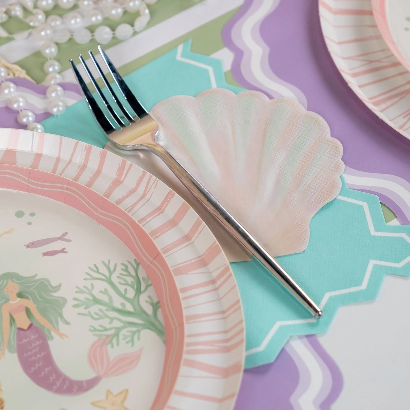 Pastel shell napkin with blush and mint tones