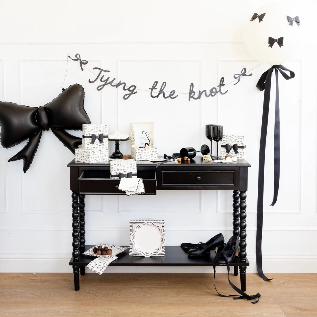 Cream guest towel with black bow illustrations