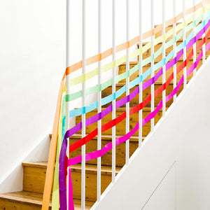 Bright Rainbow Party Streamers on stairs