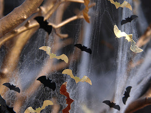 black and gold bats in spiderweb