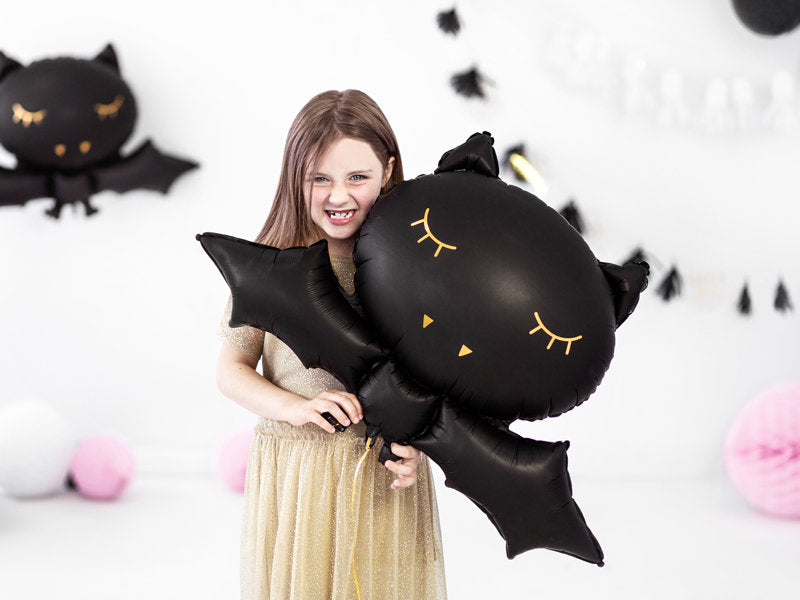 girl holding black bat