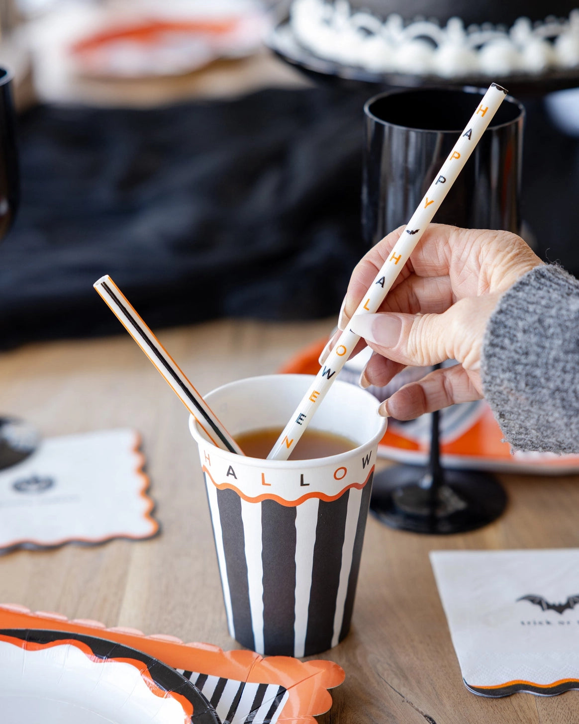 Striped Halloween party cups for drinks and spooky celebrations