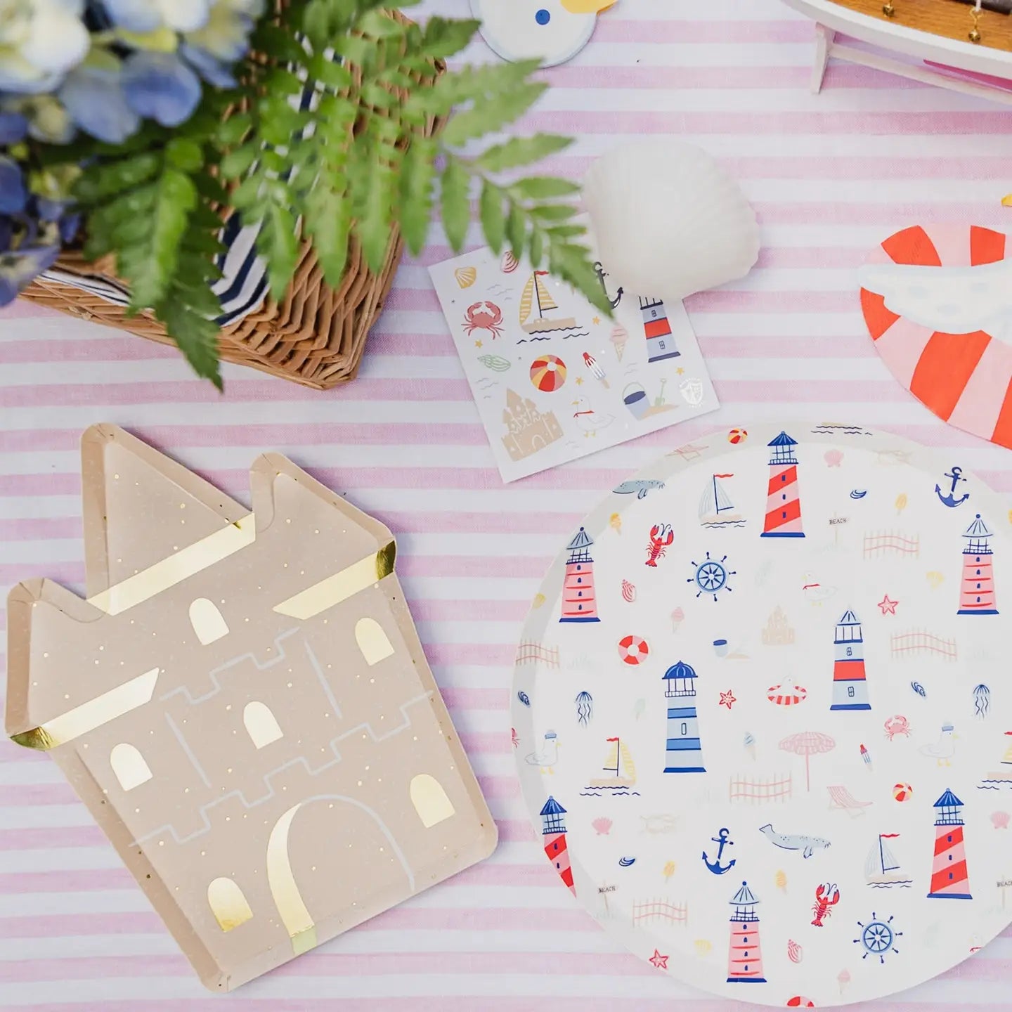Beach-themed icons dinner plates and sand castle dessert plates