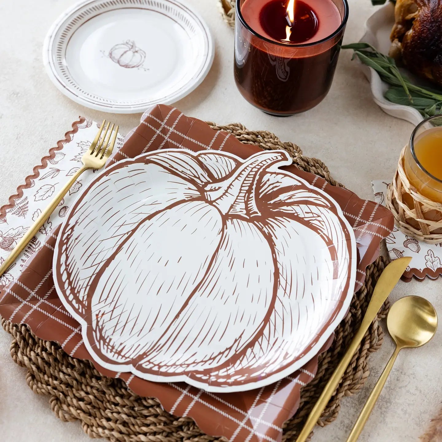 Cream pumpkin shaped paper plate with detailed brown linework