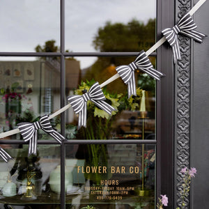 Layered bow garland on cream ribbon