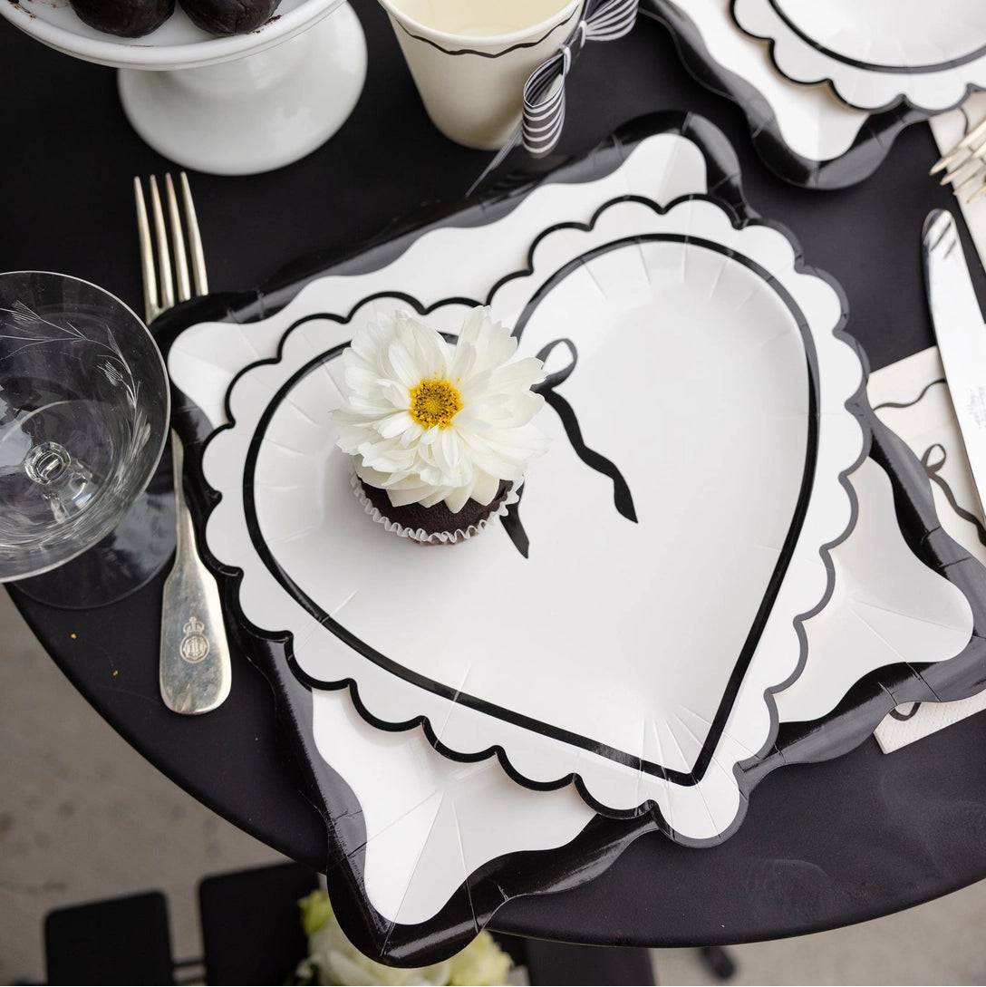 Black scalloped paper plates with cream center