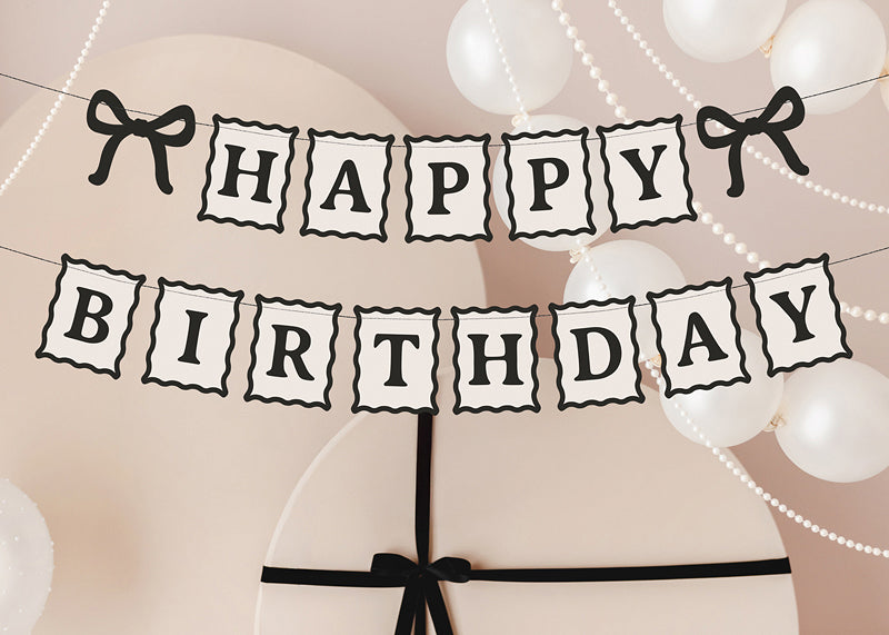 Bow themed birthday banner for milestone celebrations
