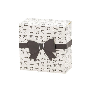 White treat box with black bow pattern