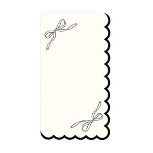 Cream guest towel with black bow illustrations