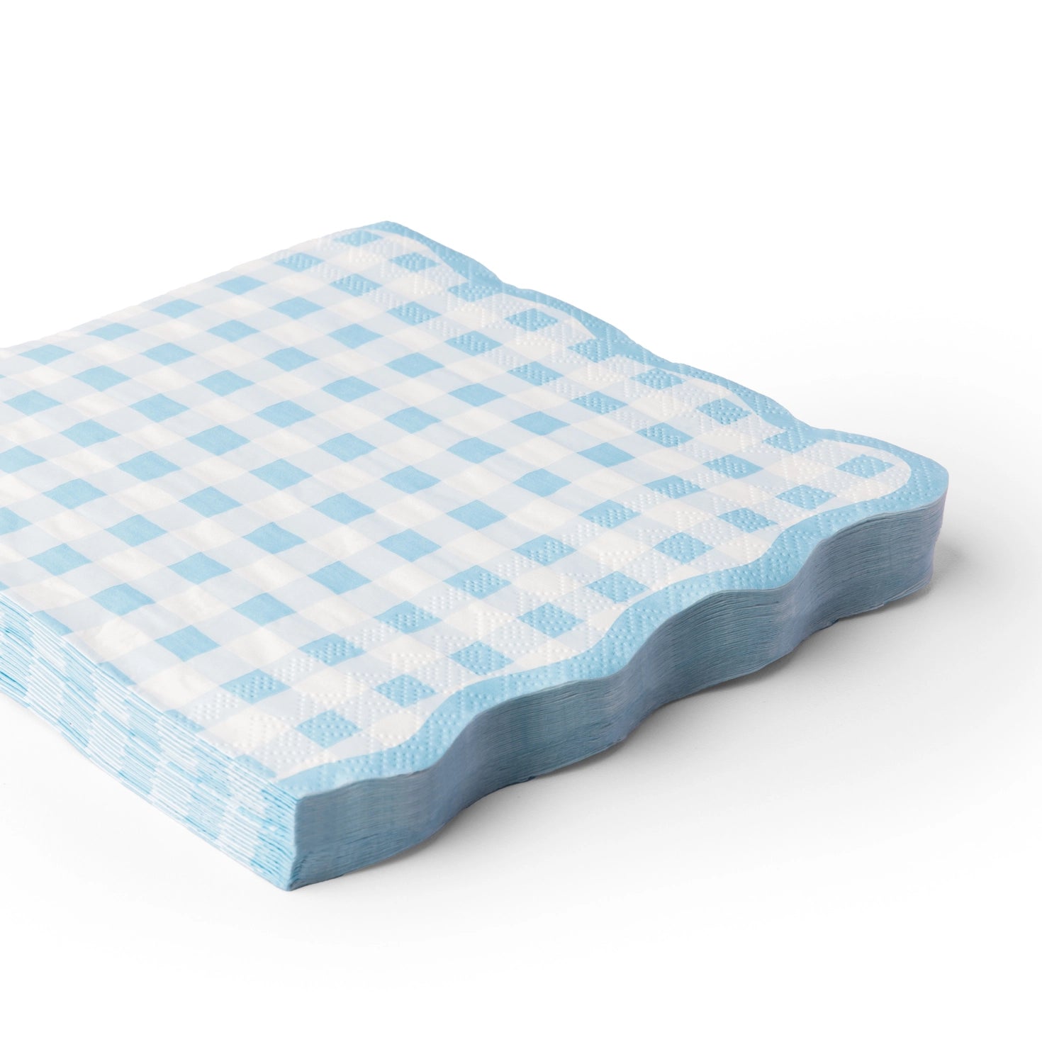 Blue gingham scalloped lunch napkins stacked