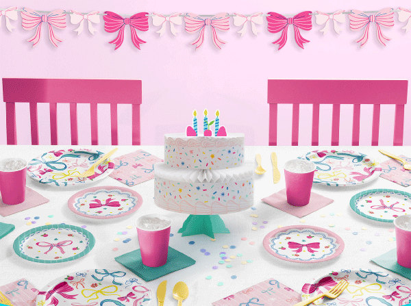 White party plate featuring pink, blue, and yellow bows