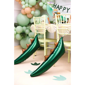 Green Dinosaur Tail Foil Balloon Tied to Chairs