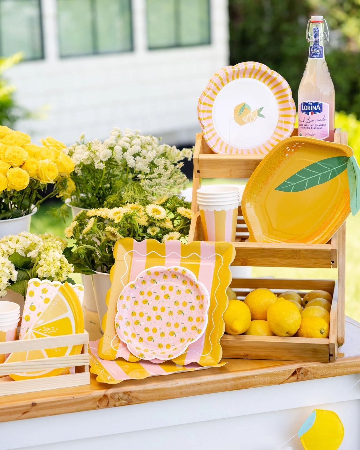 Citrus themed lunch plates styled on a party table
