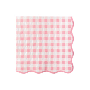 Pink gingham scalloped lunch napkins stacked on a white background