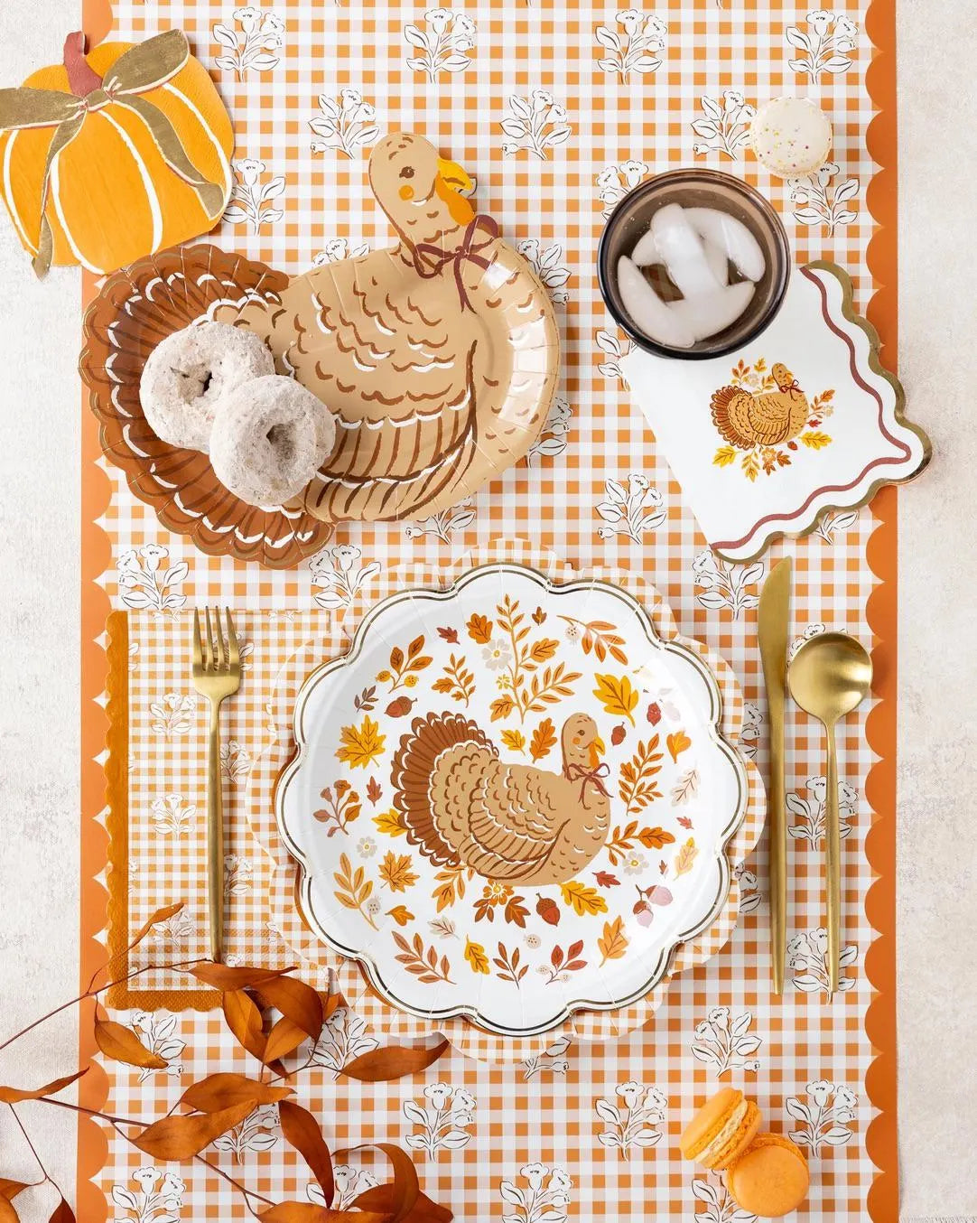 Orange and cream gingham paper guest towel with floral pattern