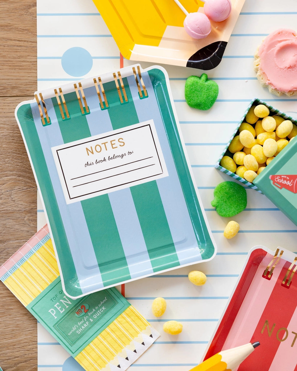 School themed party plates with colorful striped notebook designs