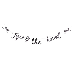 Black glitter “Tying the knot” banner with bows