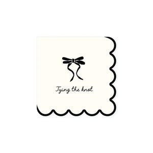 Cream dessert napkin with black bow illustration