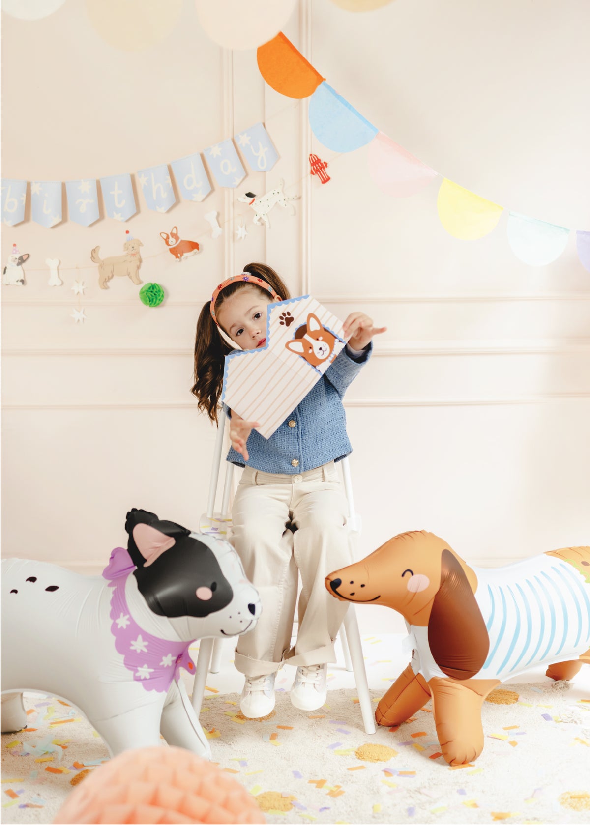 Air Filled Standing Dog Balloons and a Child Holding A Dog Owner&#39;s Card