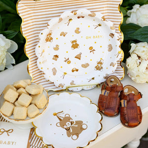 Decorative plates with teddy bear designs displayed on a table 