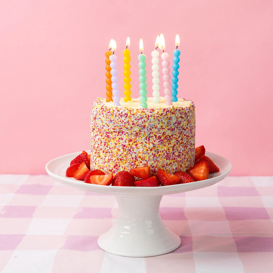 Bobble Multicolored Party Candles lit on a birthday cake | The Party Darling
