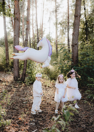 Children's party with an inflated giant unicorn balloon