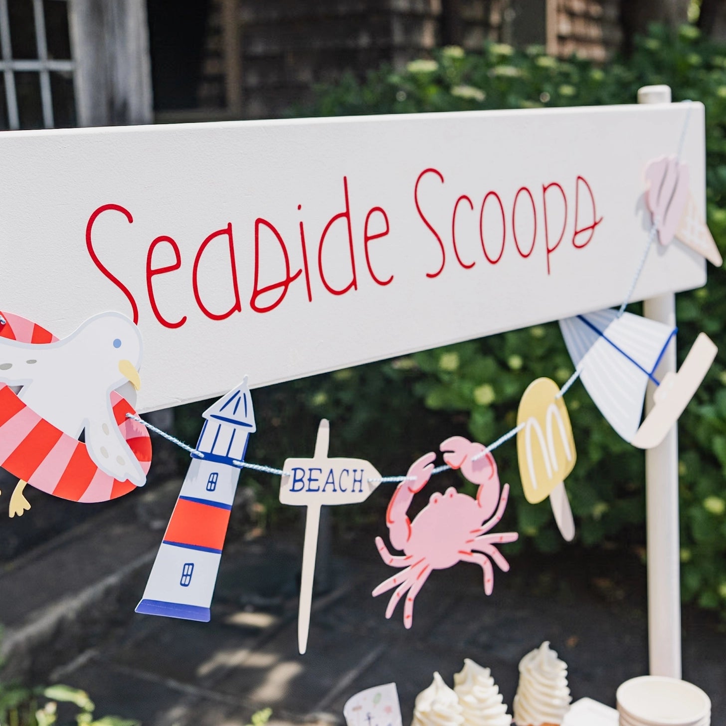 Beach-themed hanging banner with nautical icons