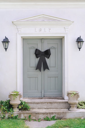 Decorative black bow on front door