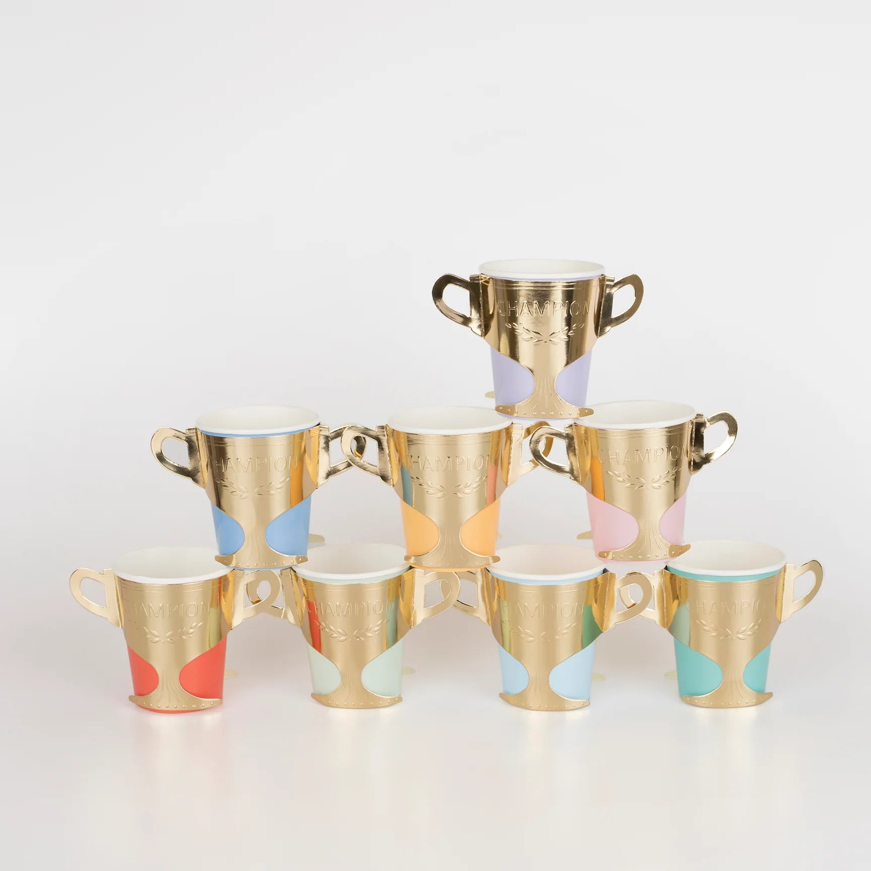 Assorted colors of paper cups with gold foil sleeves shaped like trophies