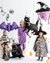 Children in Halloween costumes with themed Halloween balloons 