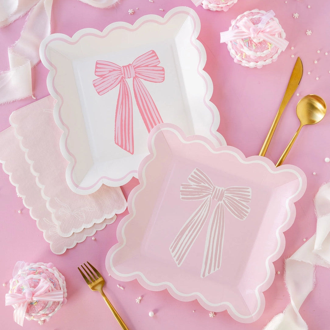 Scalloped pink and white bow plates