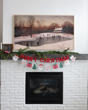 Whimsical Christmas Garland & Merry Christmas Banner on Mantle | The Party Darling