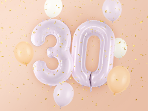 Purple number balloons combined to create 30