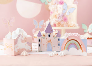 Paper treat boxes with rainbow, castle, and unicorn designs 